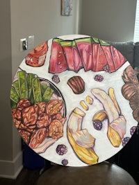 a painting of fruits and vegetables on a table